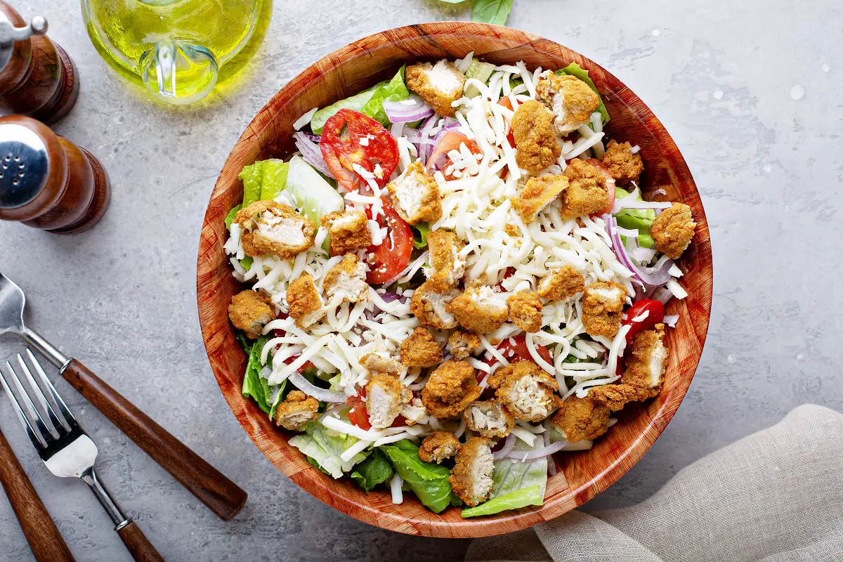 Chicken nuggets salad with lettuce